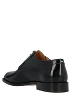 Schwarze Oxford- und Derby-Schuhe aus Kalbsleder