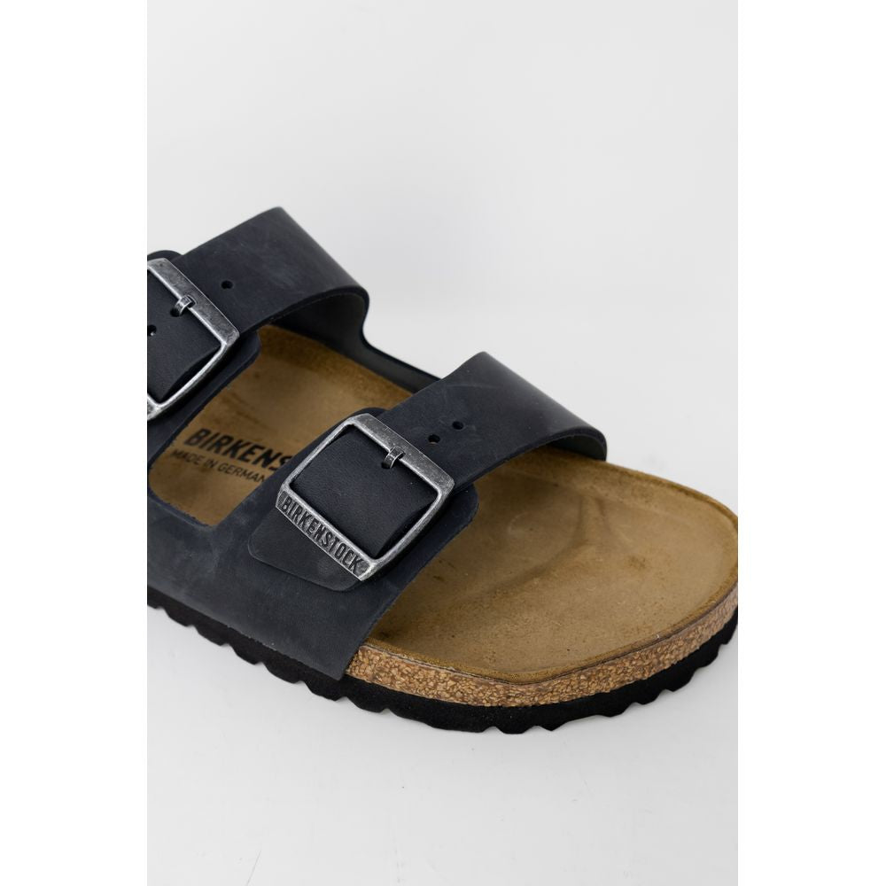 Schwarze Kunstleder-Slipper