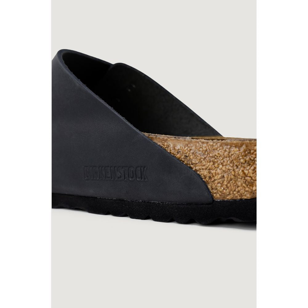 Schwarze Kunstleder-Slipper